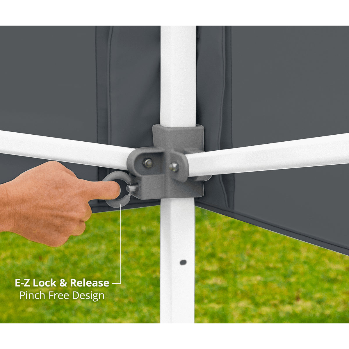 Hand using E-Z Lock & Release mechanism on a tent structure with grass background